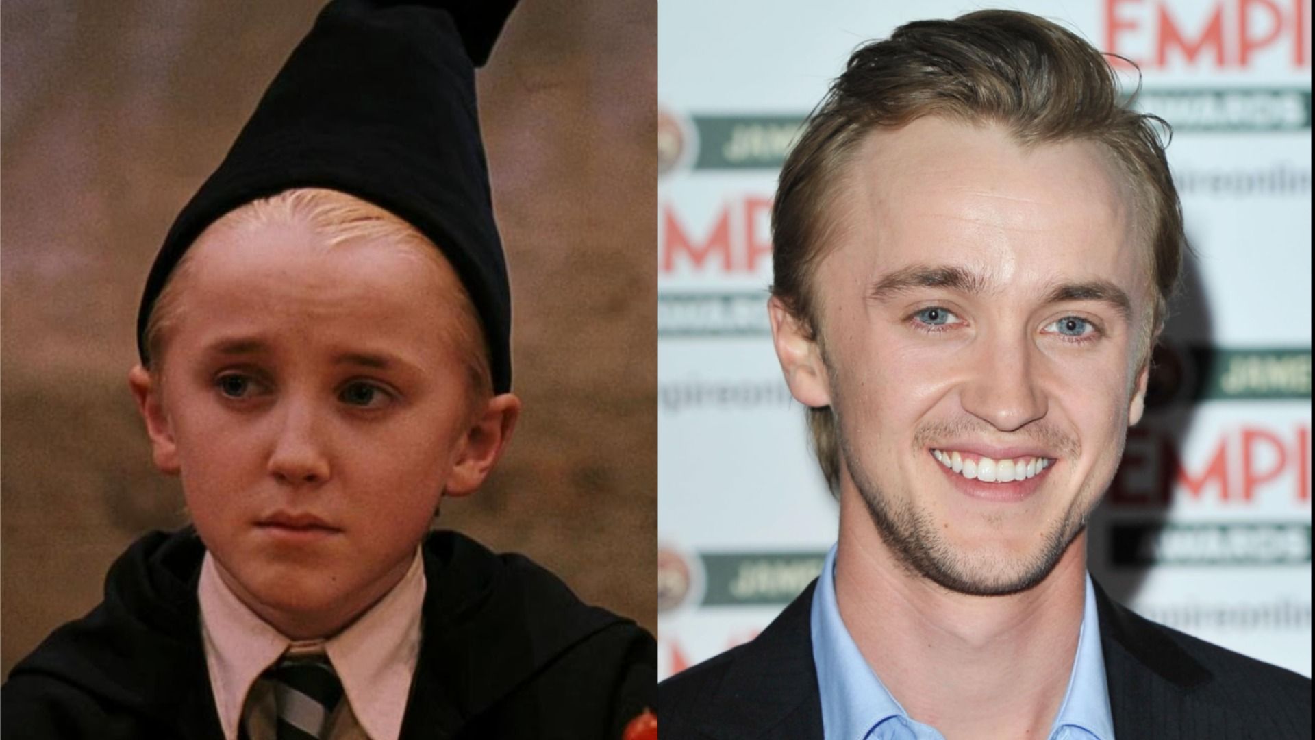 Actorul Tom Felton într-o jachetă neagră privește camera și zâmbește pe fundalul unui afiș publicitar