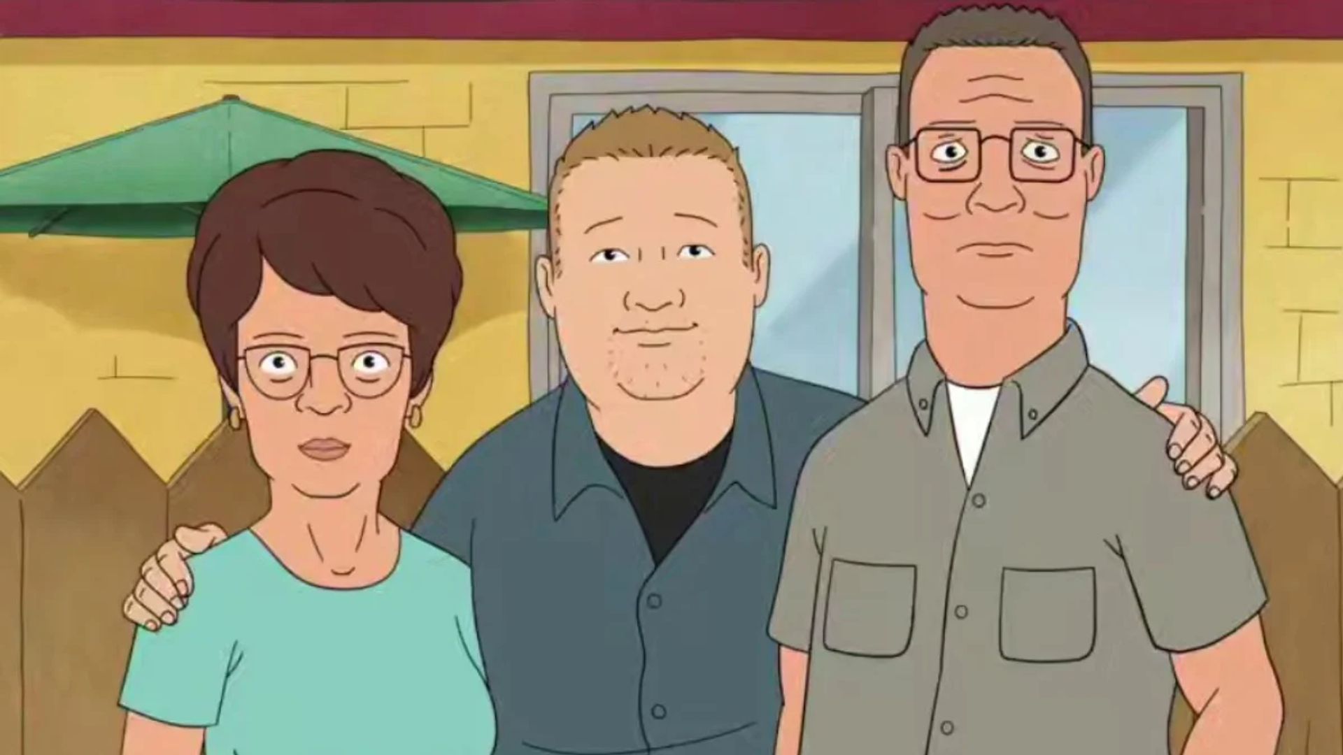 Scenă din serialul animat King of the Hill, Hank, Bobby și Peggy Hill îmbrățișându-se