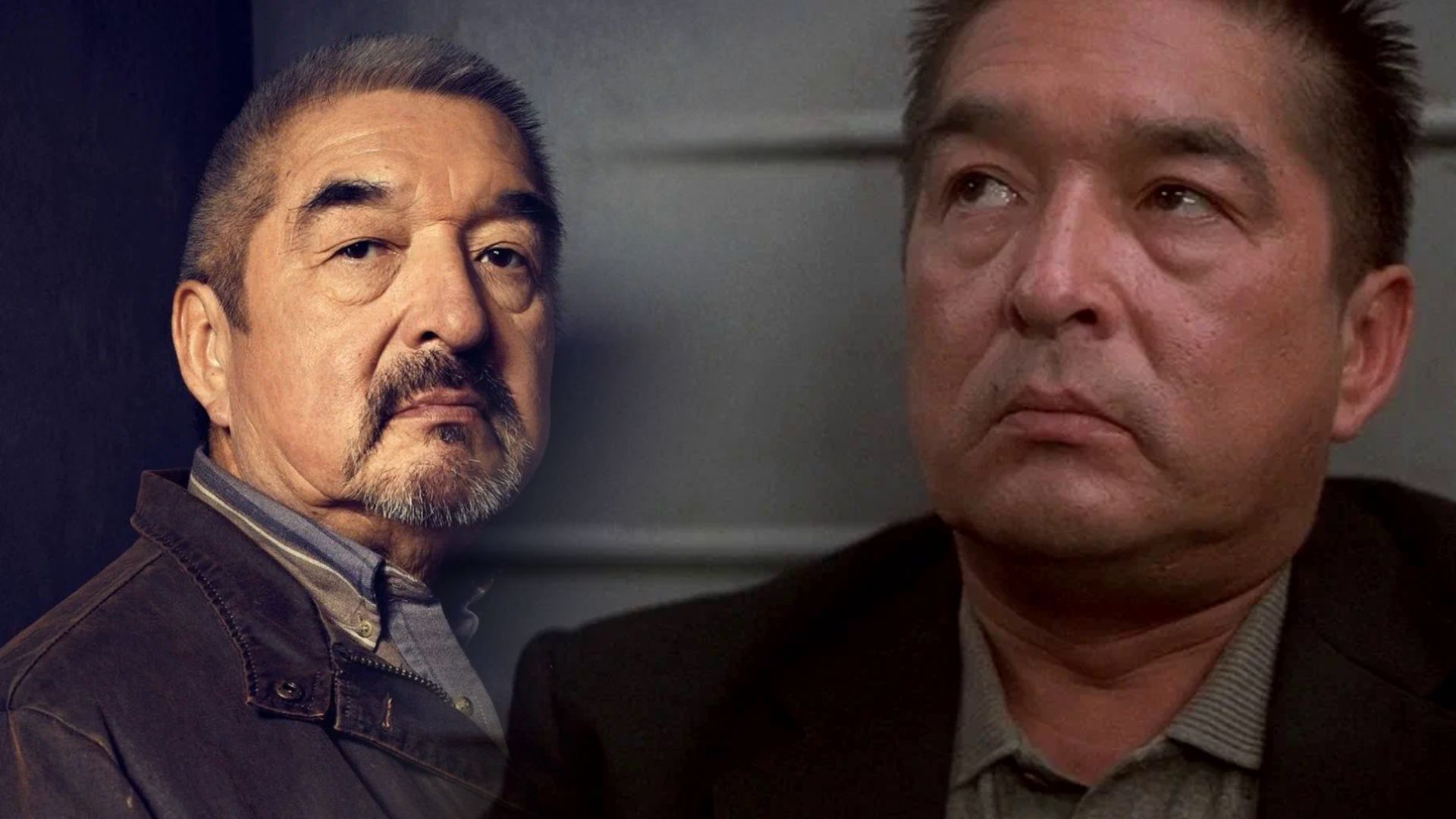 Actorul Graham Greene într-o jachetă neagră și un blazer negru se uită la cameră